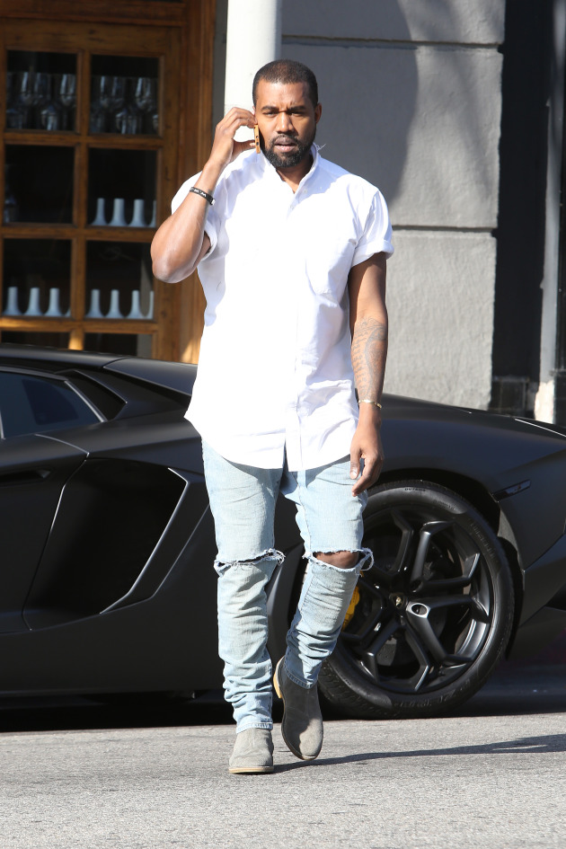 January 11, 2014: Kanye West wears ripped denim as he goes to the Adidas store in Hollywood, CA. Mandatory Credit: INFphoto.com Ref.: infusla-244/270|sp|