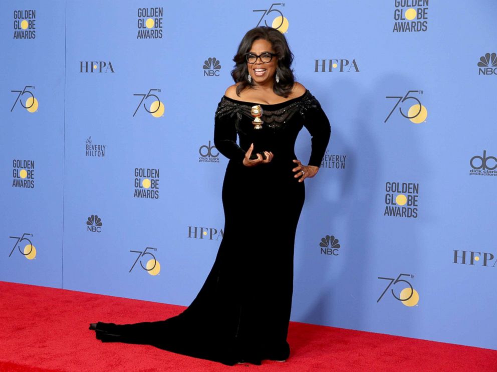 Oprah Winfrey with her Cecil B. Demille award. Photo by Lucy Nicholson/Reuters