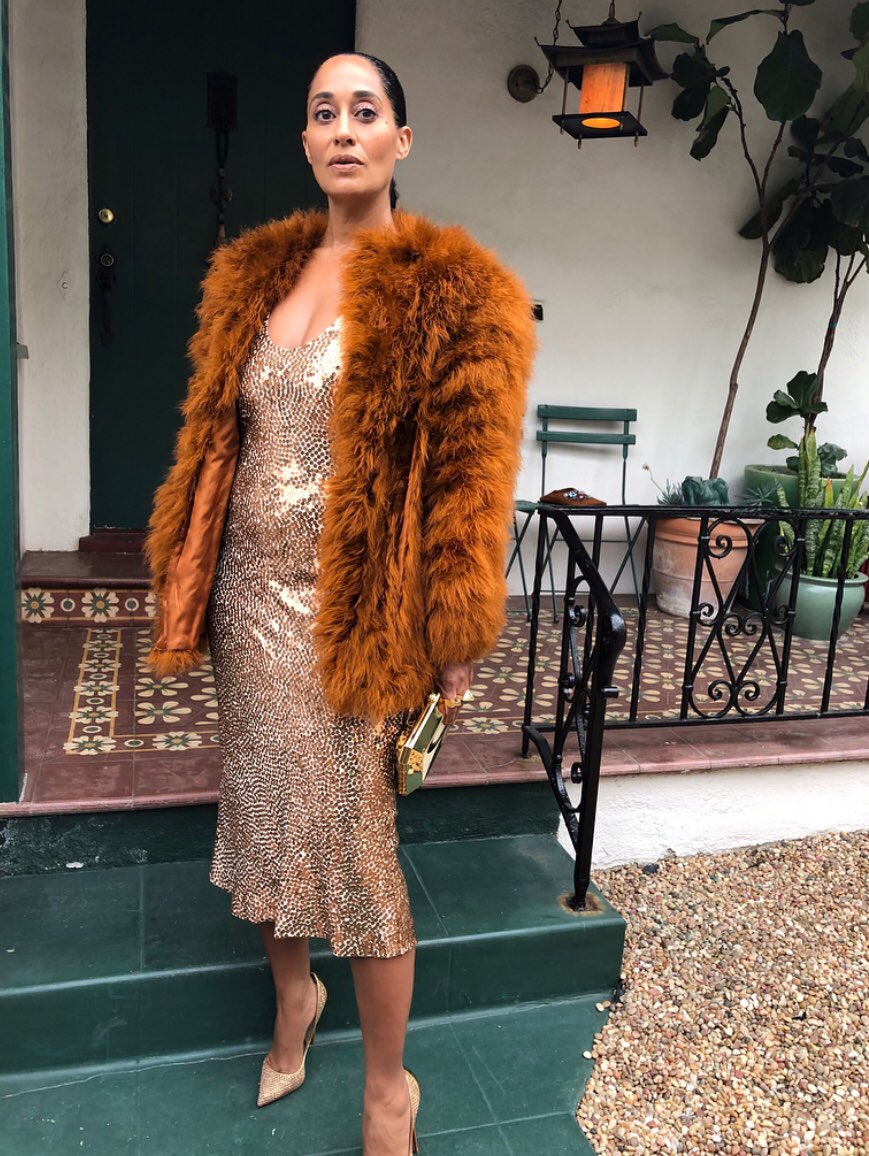Tracee Ellis Ross heading to the NAACP Image Awards wearing a Narciso Rodriguez gown with a vintage YSL coat and Tiffany & Co. jewlry with Louboutin heels. Photo via Instagram @traceeellisross