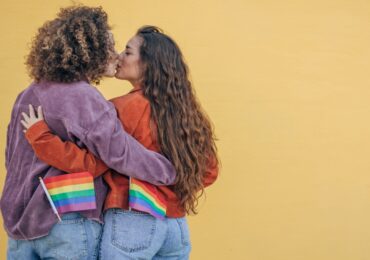 Ways to celebrate pride month - lesbian couple attending pride