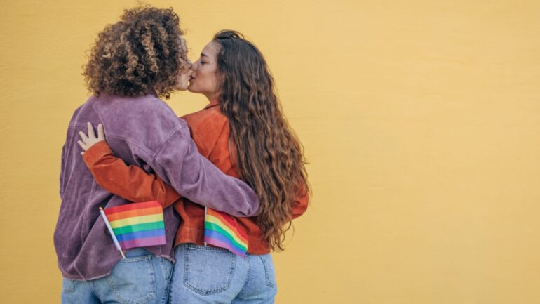Ways to celebrate pride month - lesbian couple attending pride