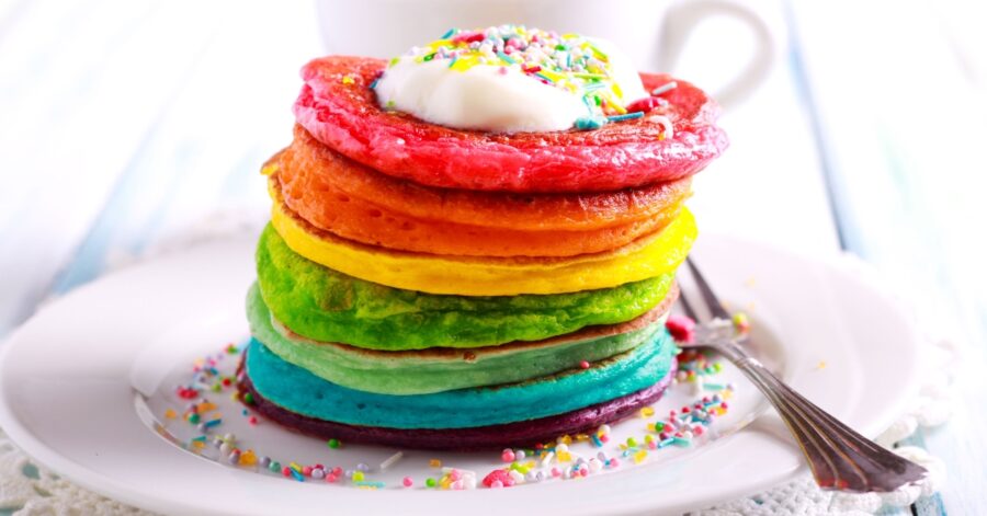 A stack of rainbow pancakes for pride brunch